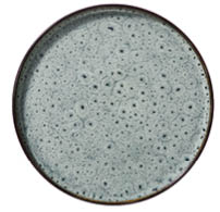 A round ceramic plate with a light gray surface featuring a textured pattern of small, irregular dark spots and fine cracks. Description generated by AI