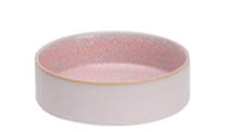 A close-up view of a ceramic bowl with a pink and white speckled pattern on the inside. Description generated by AI