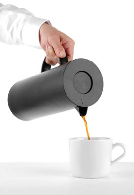 A person wearing a white long-sleeve shirt is holding a black cylindrical thermos by its handle against a white background. Description generated by AI