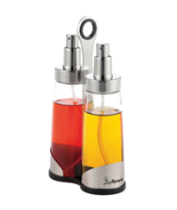 Two glass spray bottles with metal tops containing red and yellow liquids are held together in a metal and black plastic stand. Description generated by AI