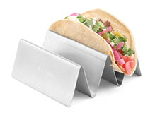 A taco holder made of metal holds a taco filled with meat, cilantro, pickled onions, and diced tomatoes. Description generated by AI
