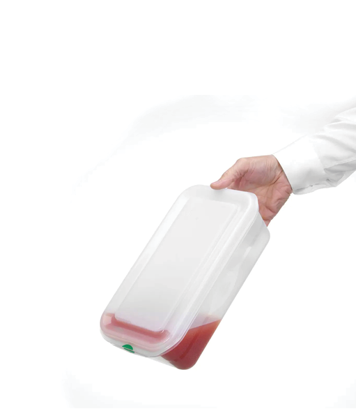 A person wearing a white long-sleeve shirt is holding a tilted translucent plastic container with a small amount of red liquid inside. Description generated by AI