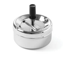 A close-up of a shiny metal ashtray with a central push-button mechanism and a black handle. Description generated by AI