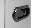 A close-up of a black recessed handle on a gray surface. Description generated by AI